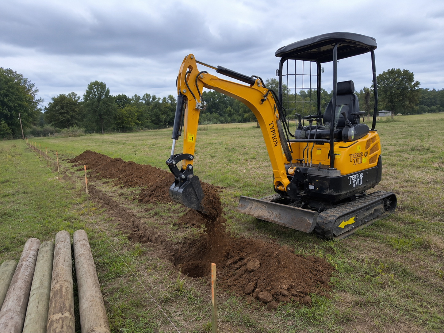 TYPHON TERROR XVIII mini excavator preparing a fence line