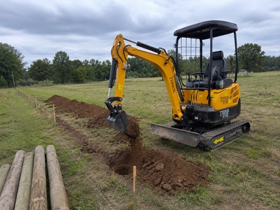 TYPHON TERROR XVIII mini excavator preparing a fence line